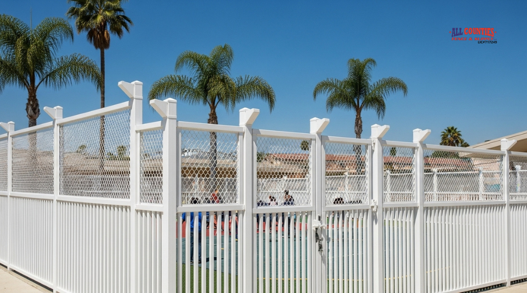 School perimeter fence in San Bernardino with anti-climb design, including vertical pickets and inward-angled extensions.